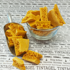 Honeycomb candy in a sweet scoop and bowl with signature tintagel wrapping paper background